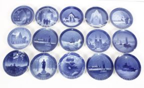 A collection of fourteen Royal Copenhagen Christmas plates, dated 1920 -30's, in blue and white,