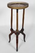 A mahogany and gilt metal jardiniere stand, the galleried top inset with rouge marble,