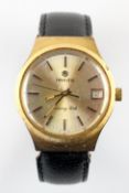 A gold plated wristwatch. Circular champagne dial, signed Imado,