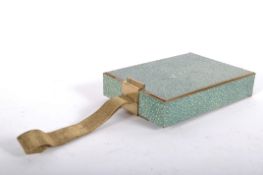 An Art Deco style gilt metal and green shagreen style cosmetics case of rectangular form,