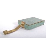 An Art Deco style gilt metal and green shagreen style cosmetics case of rectangular form,