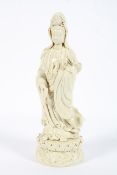 A Chinese blanc de chine figure of a Guanyin, 20th century, impressed seal mark to reverse,