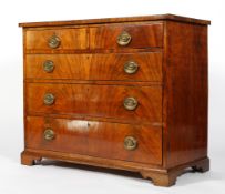A George III mahogany chest of drawers, the crossbanded top above two short and three long drawers,