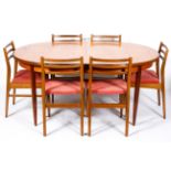 A mid-century G-Plan style dining table and six chairs, with pink upholstery,