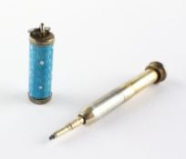 A late 19th/early 20th century yellow metal and enamel propelling pencil,