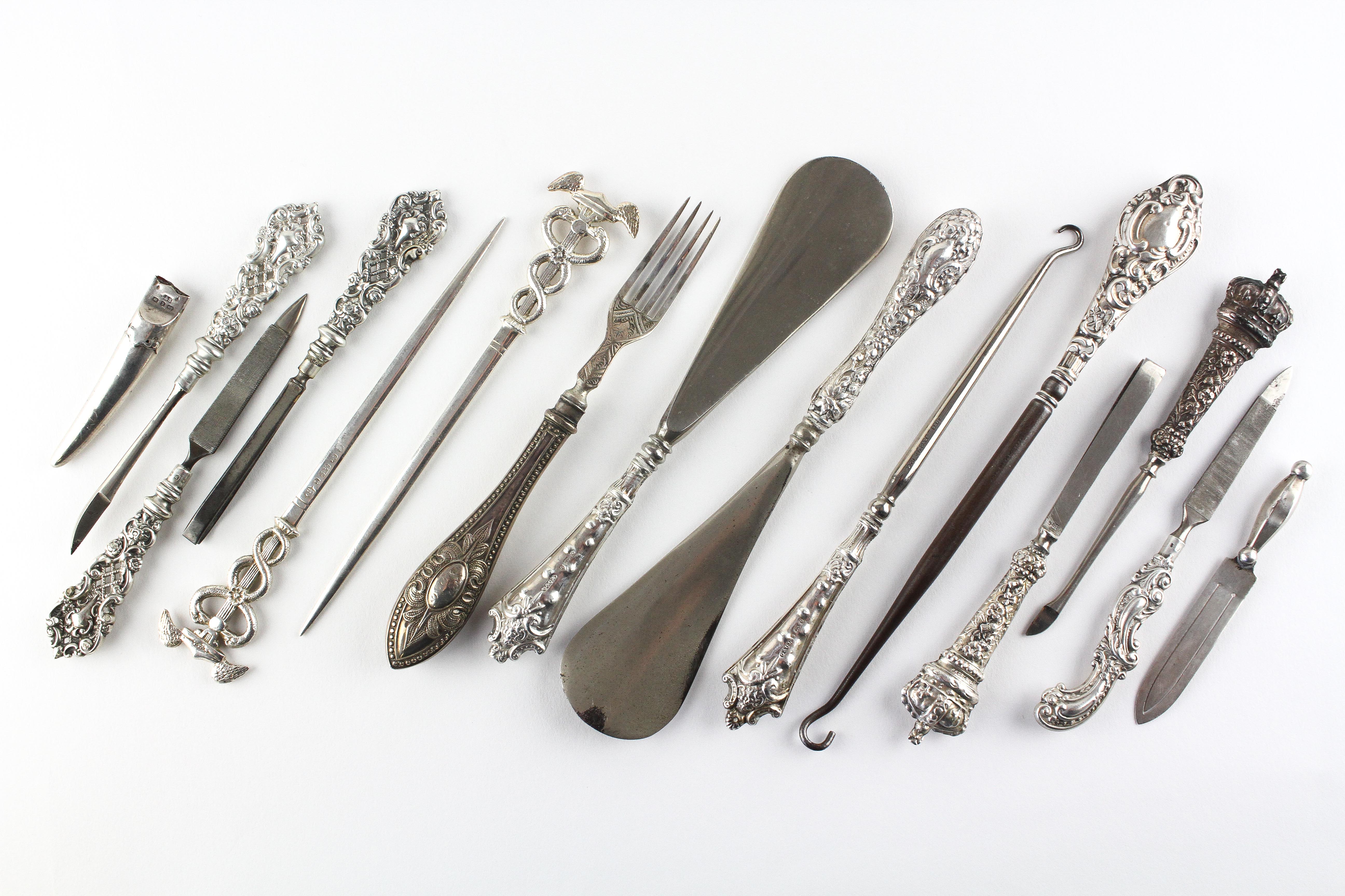 A collection of assorted silver and silver plated items, including shoehorns,