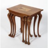 A nest of three tables, 20th century, inlaid with a coastal scene, bird and turtle, 55cm high,