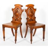 A pair of Victorian oak hall chairs, late 19th century,