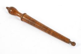 A wooden ring sizer, early 20th century, turned with knop finial, incised with sizes 1-33,