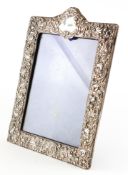 An embossed silver photo frame,