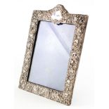 An embossed silver photo frame,