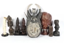 A collection of tribal art, including: two carved and painted theatrical masks, 52 cm long maximum,