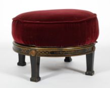 A Victorian ebonised circular stool, late 19th century, with canework top,