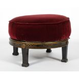 A Victorian ebonised circular stool, late 19th century, with canework top,