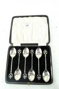 A cased set of six George V silver coffee spoons with decorative terminals,