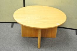 A circular oak coffee table,