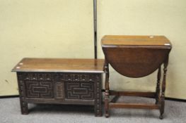 A small oak coffer, 47cm x 84cm x 32cm, together with an oak drop leaf occasional table,