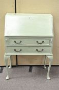 A chalk painted fall front bureau, the fall front above two drawers,