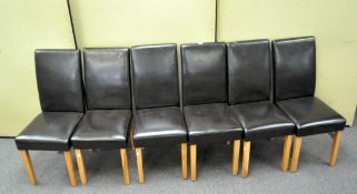A set of six modern chairs with brown leather effect upholstery,