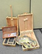 A collection of artists materials, including two portable Artists box easels,