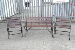 A garden bench and two chairs with cast metal ends,