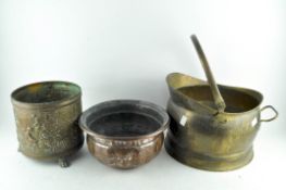 A brass coal bucket together with two other similar items