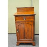 A mahogany pot cupboard,