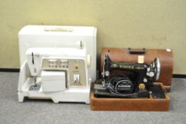 A Singer sewing machine in a wooden case and another in a plastic case