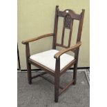 An early 20th century Arts and Crafts style elbow chair,