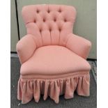 A 20th century pink button back armchair,