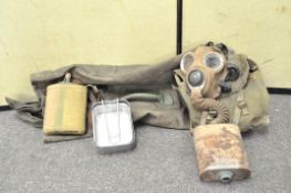 A military bag containing various items,