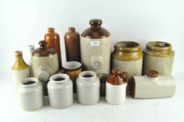 A collection of stoneware flagon's and storage pots,