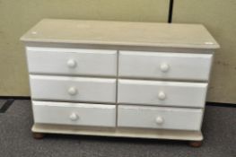 A painted chest of six drawers,