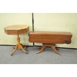 A reproduction drum style occasional table and another drop leaf table,