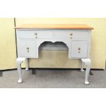 A mahogany and grey painted kneehole desk with four drawers,