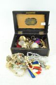 A Victorian box containing assorted costume jewellery including necklaces