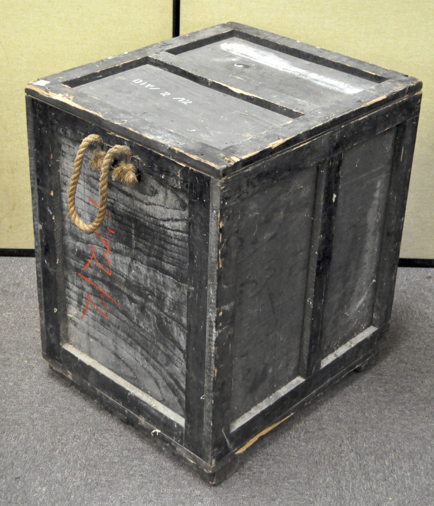 A large black painted wooden storage box, probably RAF military,