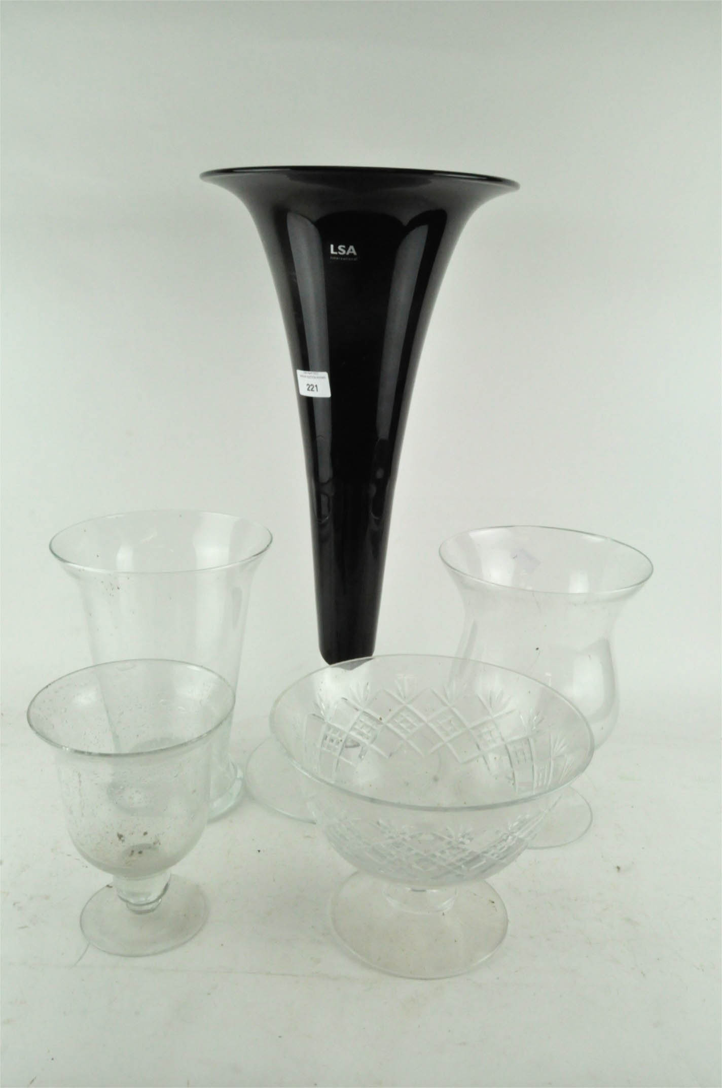 An LSA international trumpet shaped glass vase, together with four other glass vases,