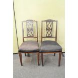 A pair of Regency style mahogany and inlaid dining chairs,