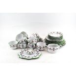 A Continental porcelain tea service printed with pink roses and green husk swags,
