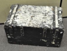 A black painted wooden box of rectangular form,