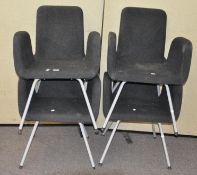 A set of four contemporary swan style chairs in grey fabric upholstery,