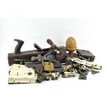 A collection of assorted items, including tools, a box plane,