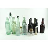 A collection of fifteen vintage glass bottles,