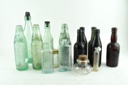 A collection of fifteen vintage glass bottles,