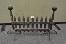 A wrought iron fire front,
