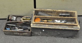 A selection of tools in a wooden box and tray, including pliers,