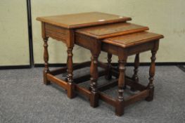 A nest of three Oak occasional tables,