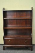 A mahogany waterfall book shelves, possibly by Stag,