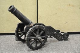 A large cast iron model of a cannon,